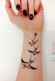 girl arm on the black abstract line small animal swallow tattoo picture