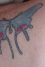 Papillon bleu avec motif de tatouage tacheté de rouge