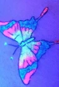 Skinnende fluorescerende tatovering