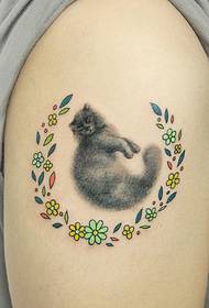Gray cat tattoo surrounded by thousands of flowers
