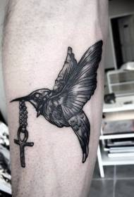 Engraving style black bird with cross tattoo pattern