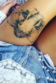 Girl thigh on black pricking small animal like tattoo picture