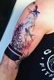 Boy painting on the arm with splashes of flowers and bird tattoo pictures