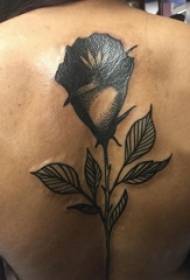 Niña de vuelta en el punto negro espina línea simple planta creativa flor tatuaje foto