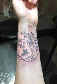 Girl wrist on black geometric simple line creative plant life tree tattoo picture