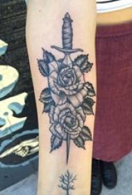 Girl's arm on black gray point thorn simple line plant flower and dagger tattoo picture