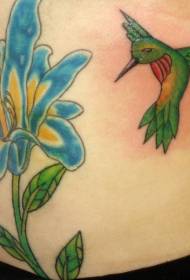Green hummingbird and blue flowers tattoo pattern