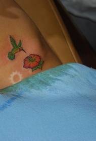 Waist side small hibiscus flower and hummingbird tattoo picture
