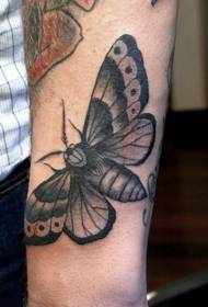 Black moth arm tattoo pattern