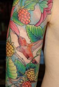Arm colored exotic flowers and hummingbird tattoo