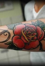 arm letters with red rose tattoo pattern