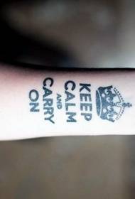 arm black letters with crown tattoo pattern