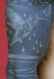 cute white hummingbird and black background arm tattoo pattern