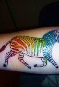 vivid colored zebra tattoo pattern on the arm