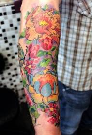 bright floral tattoos on the arms