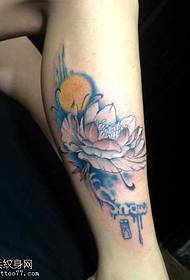 Girl's legs, lotus tattoo pattern