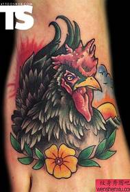 An interesting cock tattoo on the instep