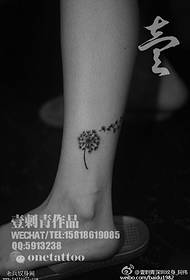 Classic dandelion tattoo on the ankle