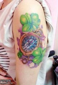 Arm clock, four-leaf clover tattoo
