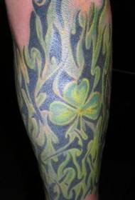 Green clover and tribal flame tattoo pattern