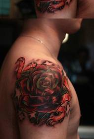 A colorful rose tattoo pattern that is popular in the arm