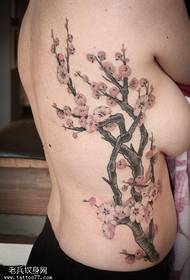 Plum tattoo on the chest side