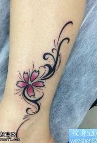 Leg sakura with totem vine tattoo pattern