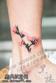 Plum tattoo on the ankle