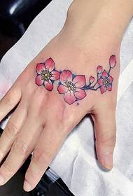 Several delicate and beautiful little flower tattoos