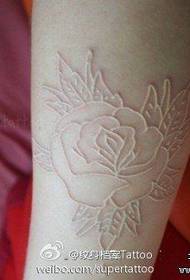 a white line rose tattoo pattern
