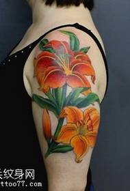 a lily tattoo pattern on the shoulder