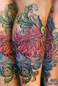 Beautiful colorful chrysanthemum tattoo pattern on the legs