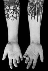 Schoolgirl's arm on black pricked simple lines plant leaves and flowers tattoo pictures