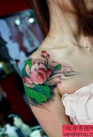 Colorful lotus tattoo pattern on girl shoulder