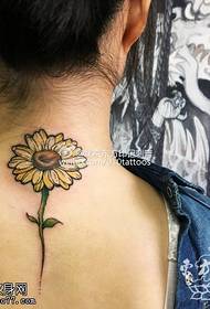 Small daisy tattoo pattern on the shoulder