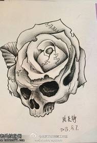 tatovering manuskript billede af kranium rose