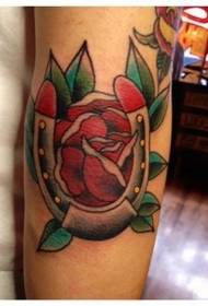 Arm color old school red rose and horseshoe tattoo