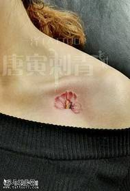 Small fresh flower tattoo pattern on the chest
