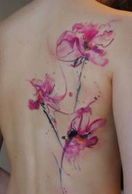 女性の背中の水の色の蘭のタトゥーパターン