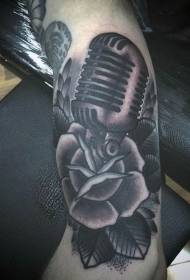 Arm gray vintage microphone and rose tattoo