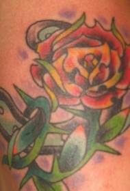 Foto de tatuaje de herradura de color de pierna y rosa espinosa