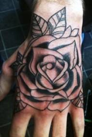 Girl's wrist on black gray sketch point sting technique beautiful rose tattoo picture