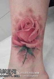 Pink rose tattoo on the ankle
