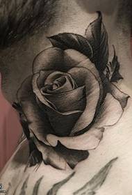 Pointing rose tattoo on the neck