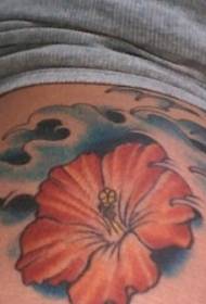 Shoulder colored hibiscus with wavy tattoo pattern