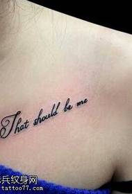 Small English tattoo on the collarbone