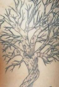 Gray tree tattoo pattern on ribs