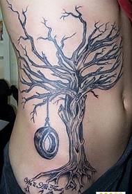 a personalized tattoo pattern with a tire on a dead tree