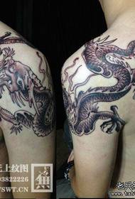 male shoulder is a cool black and white dragon tattoo pattern  148884 - a very cool black and white half dragon tattoo pattern