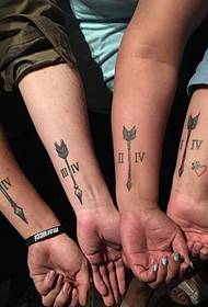 Family Arm Roman numerals and arrow pattern tattoo